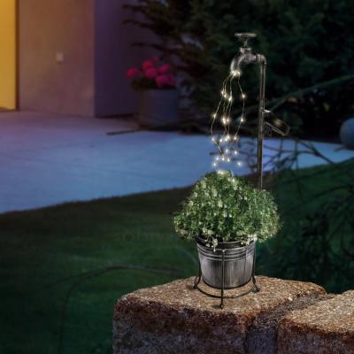 Robinet déco avec faisceau de lumières solaire et jardinière                    